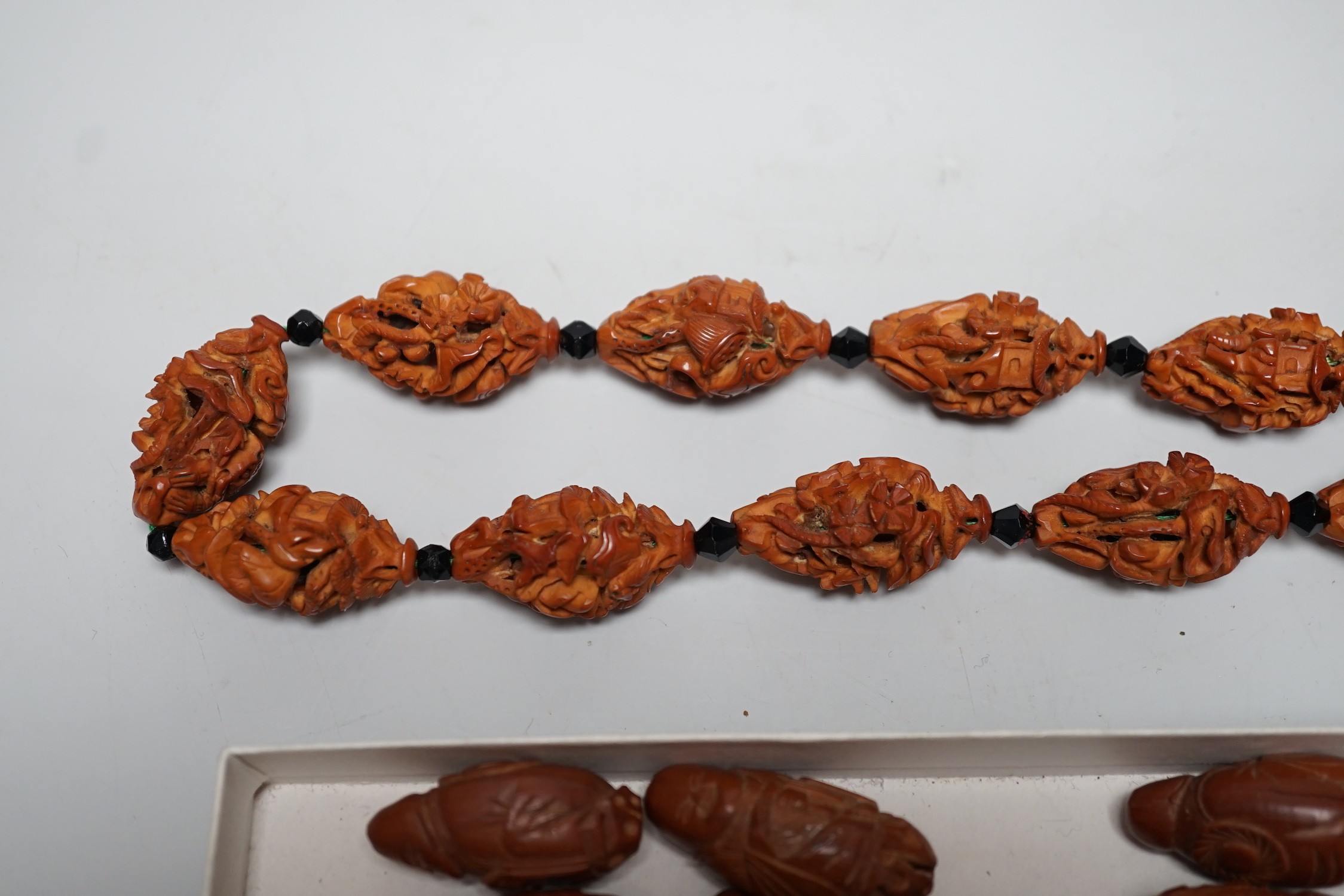 A collection of Chinese carved peach stones, early 20th century